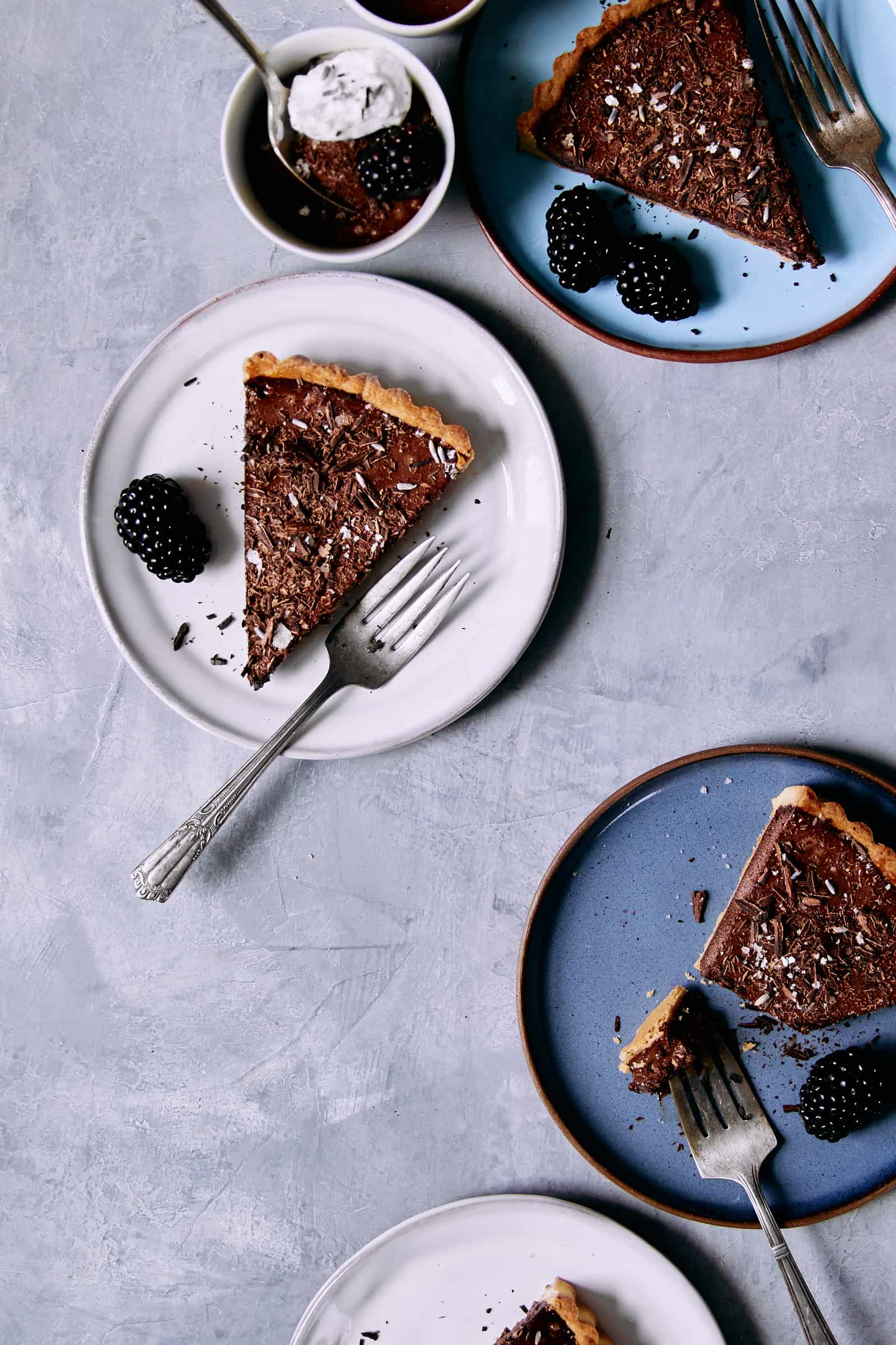 Sliced chocolate mousse tart with berries