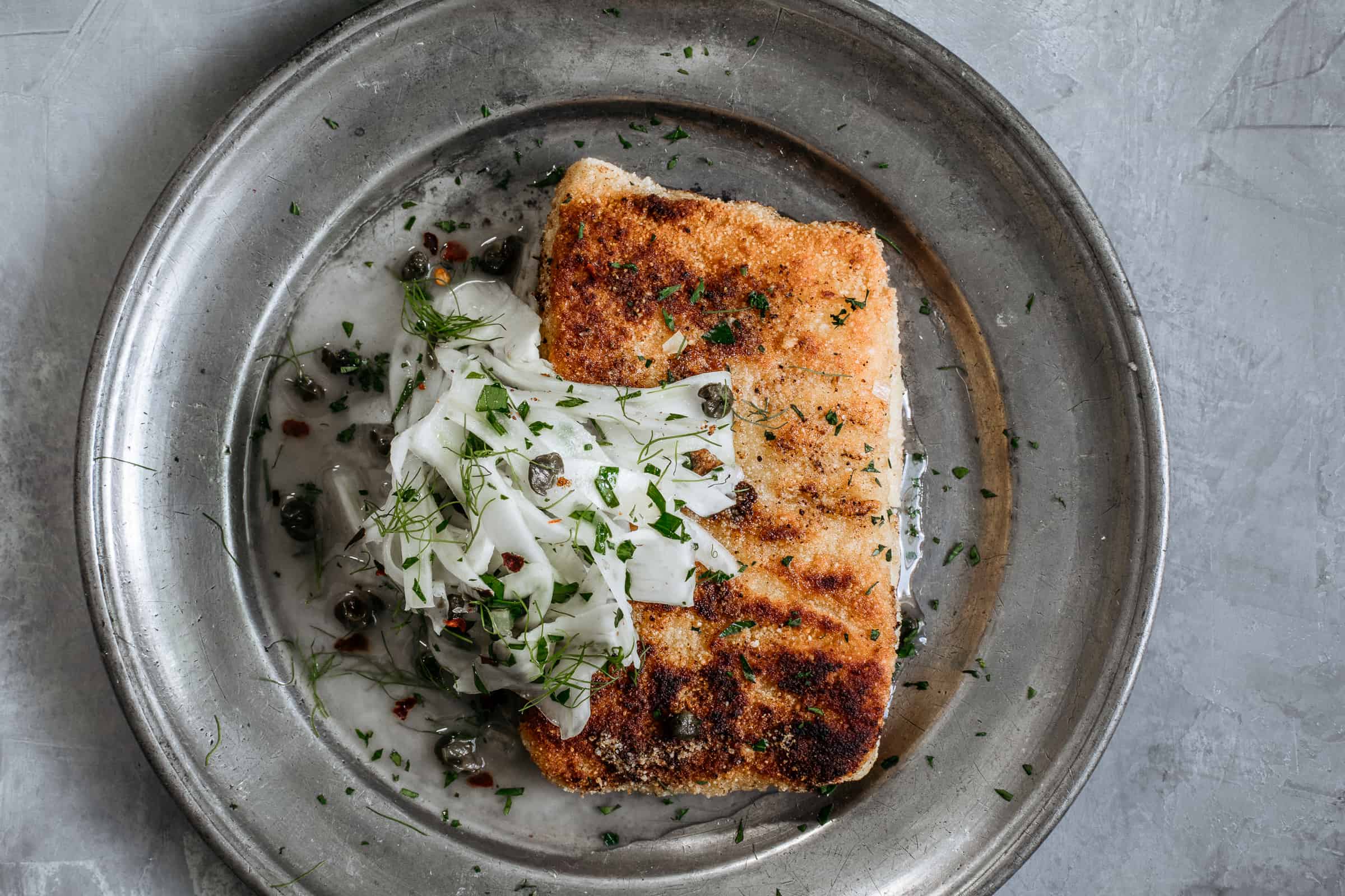 While almond crusted fish piccata may bear little resemblance to the red-and-white checkered classic, it’s fresher, nuttier & keeps all the familiar flavors.