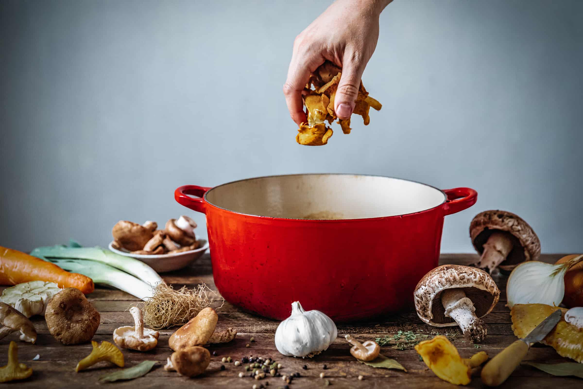 Adding mushrooms to the stock pot