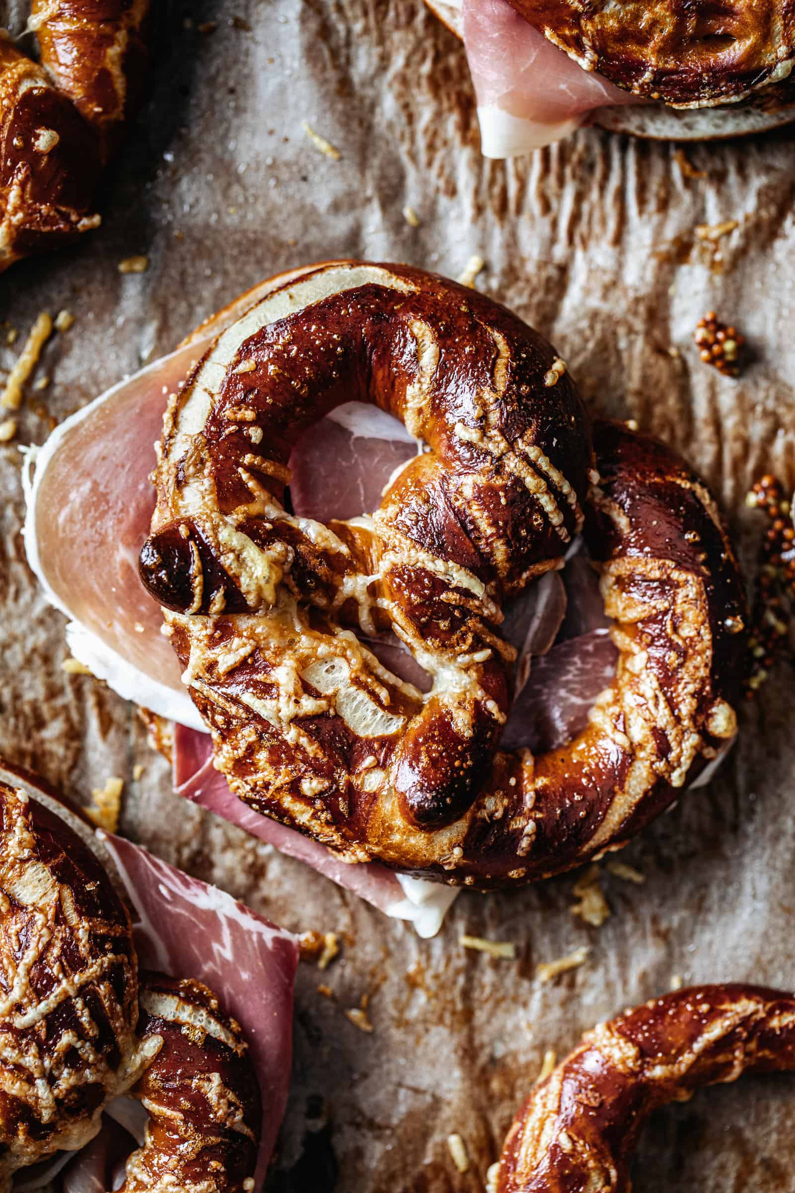 Close-up of Parchment lined with Soft Pretzels with Speck and Gruyere