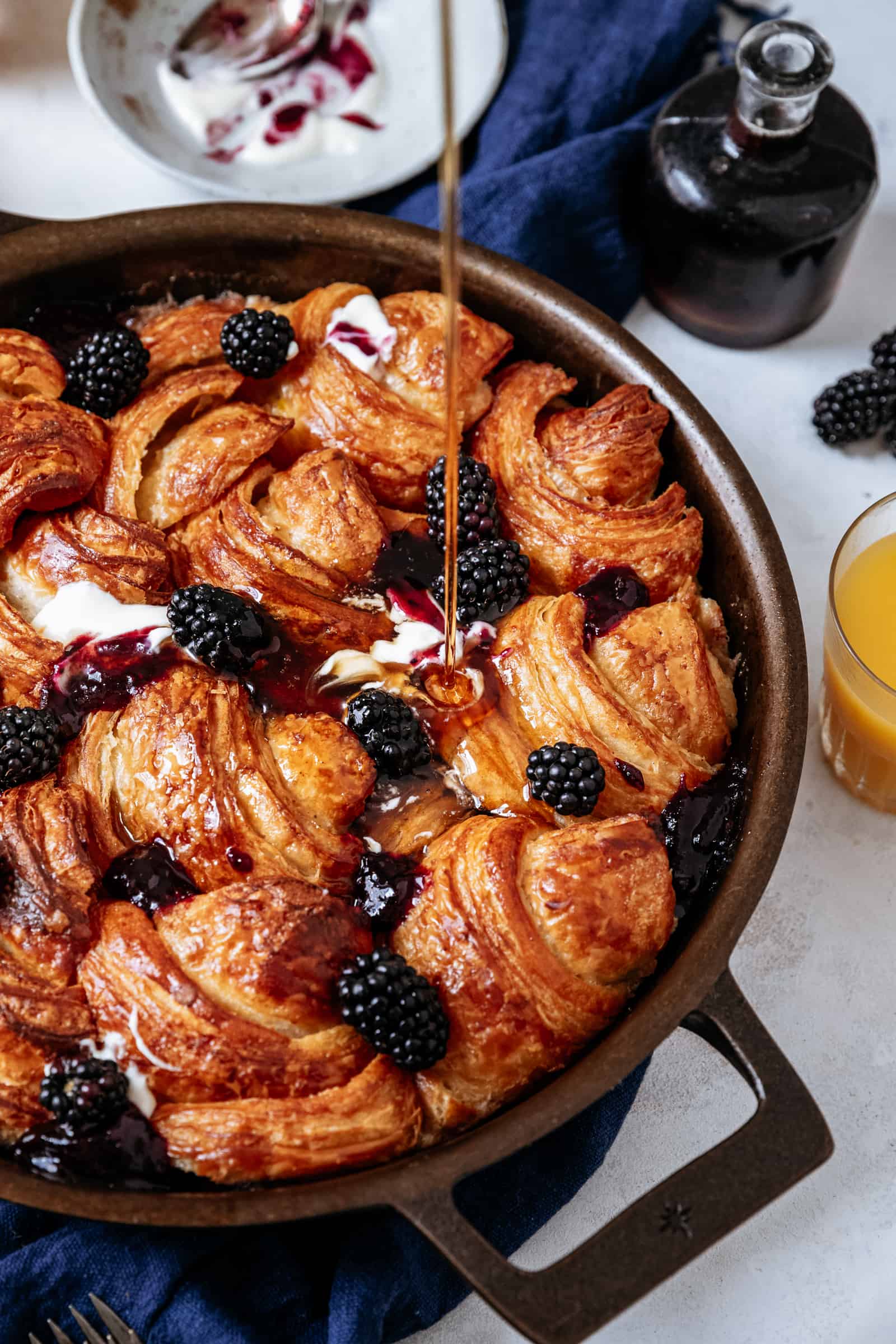 Maple syrup poured onto the croissants