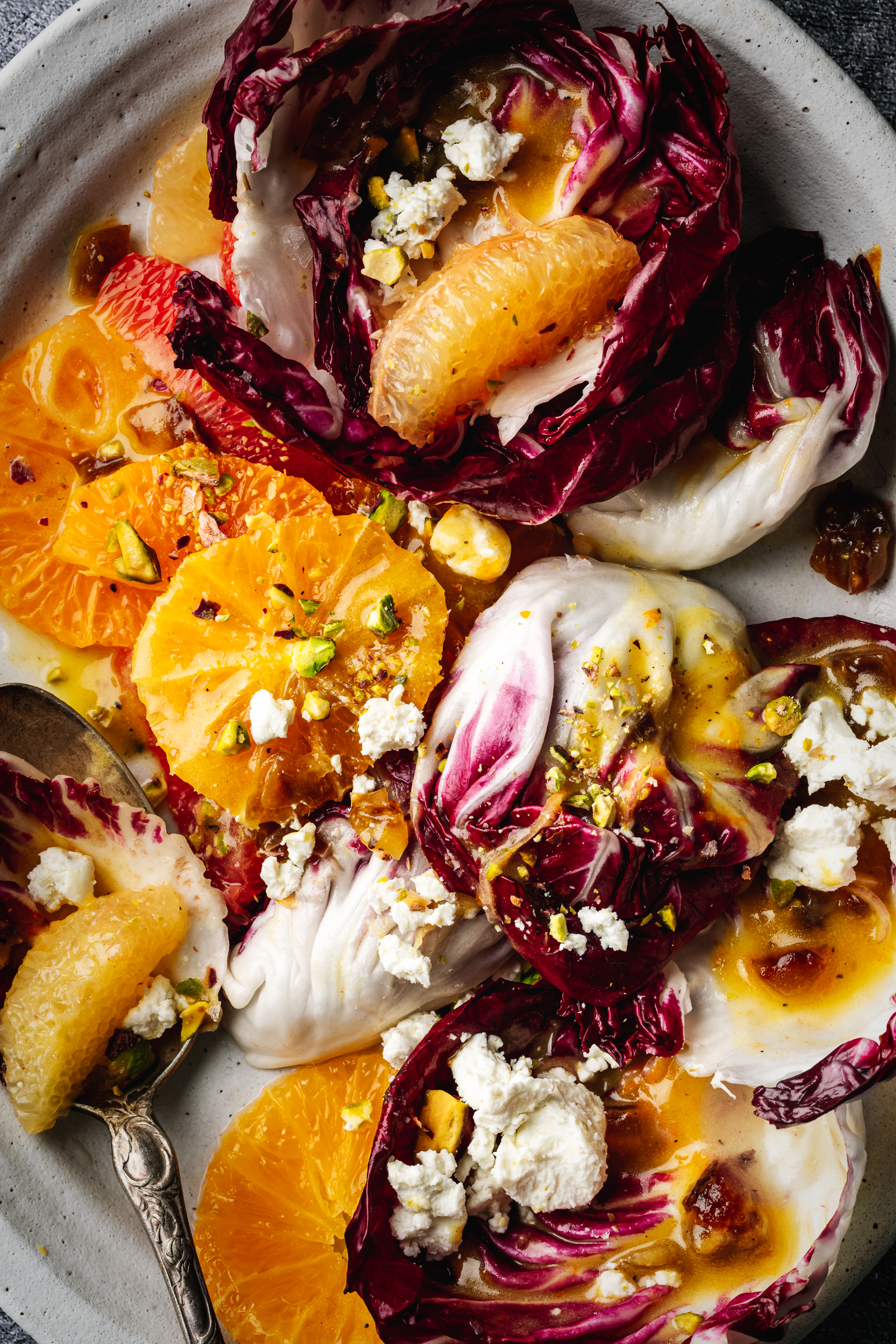 Close up of oranges, radicchio and goat cheese