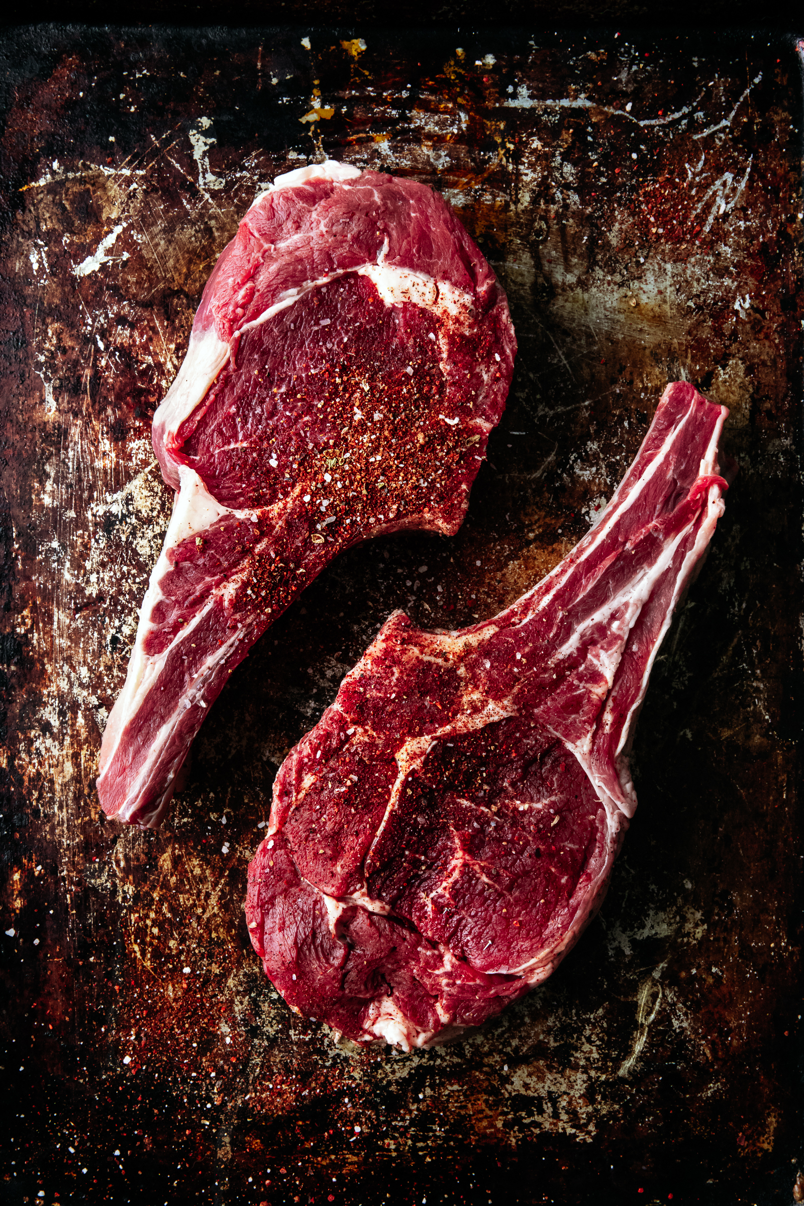 Ribeye cowboy steaks with coffee-rub