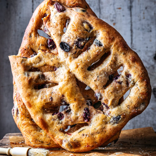 Fougasse bread stacked on a wooden crate